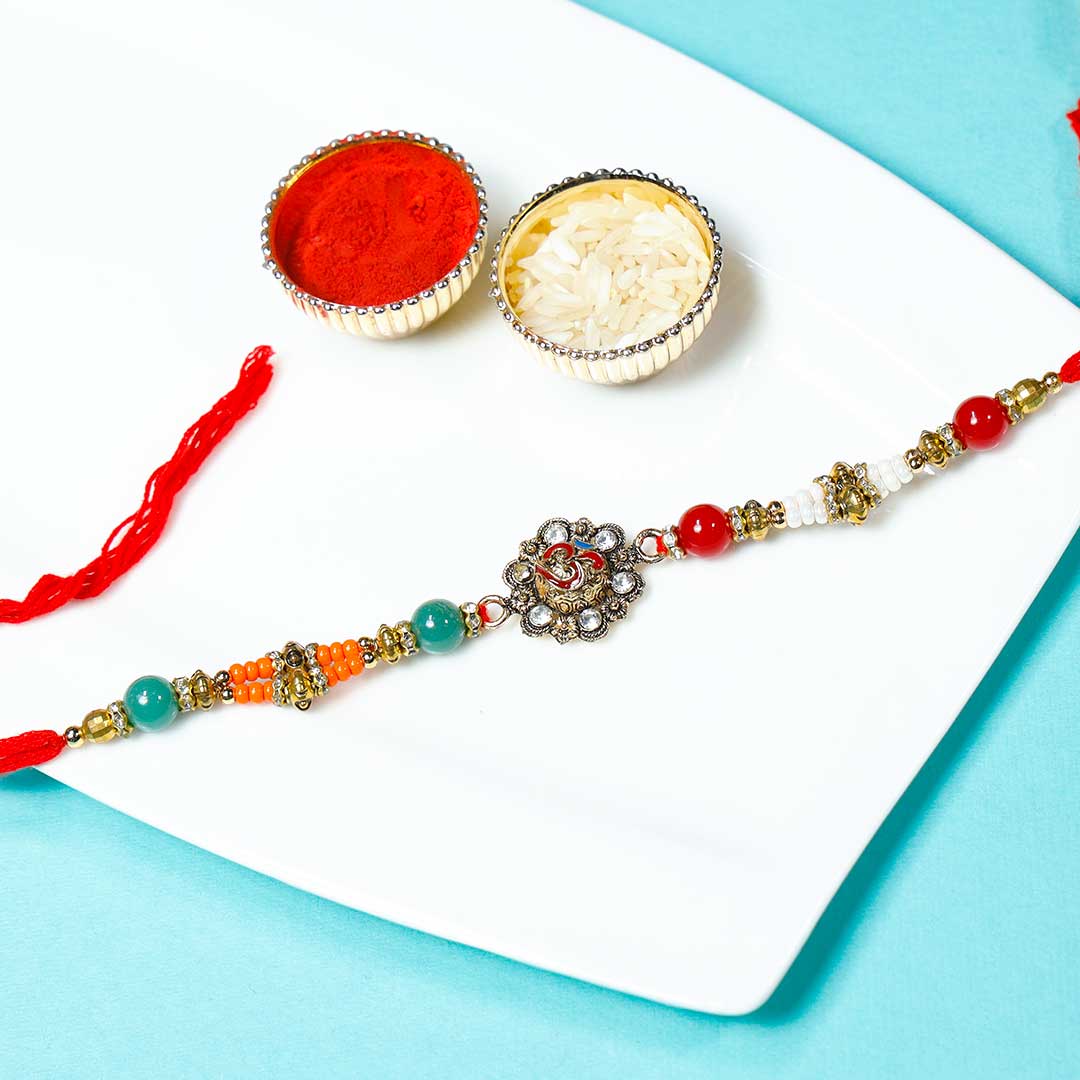 Designer OM Rakhi With Panjiri Ladoo N Almond Dragees