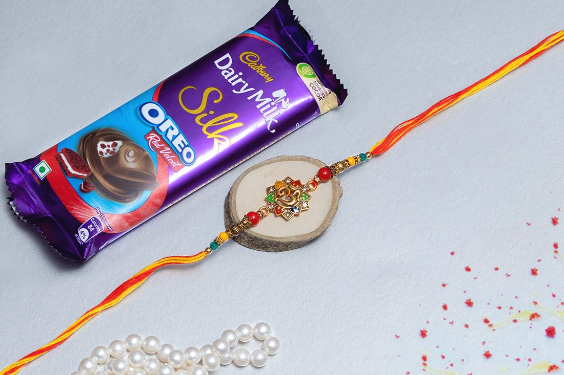 Ganesha Rakhi And Dairy Milk Set