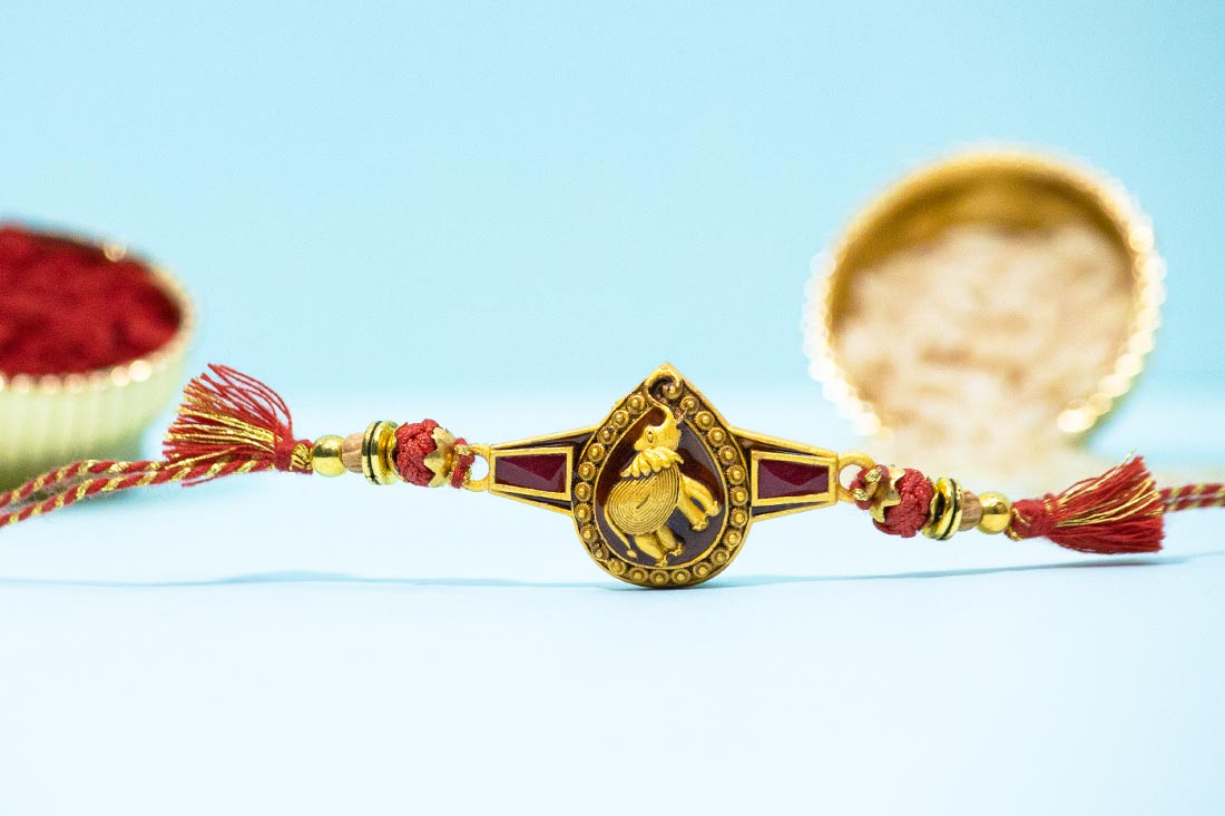 Golden plated elephant rakhi