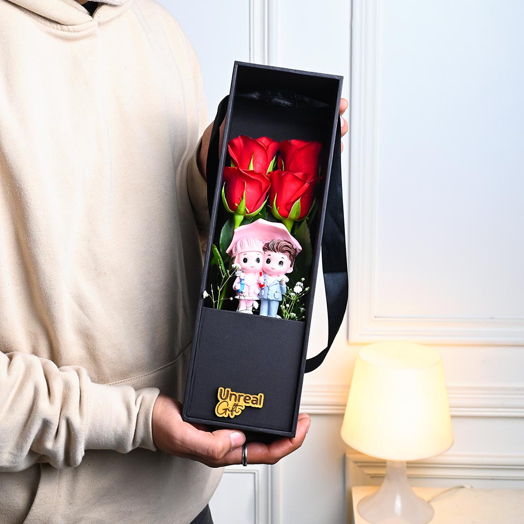 Red Roses In Black Box With Cute Couple