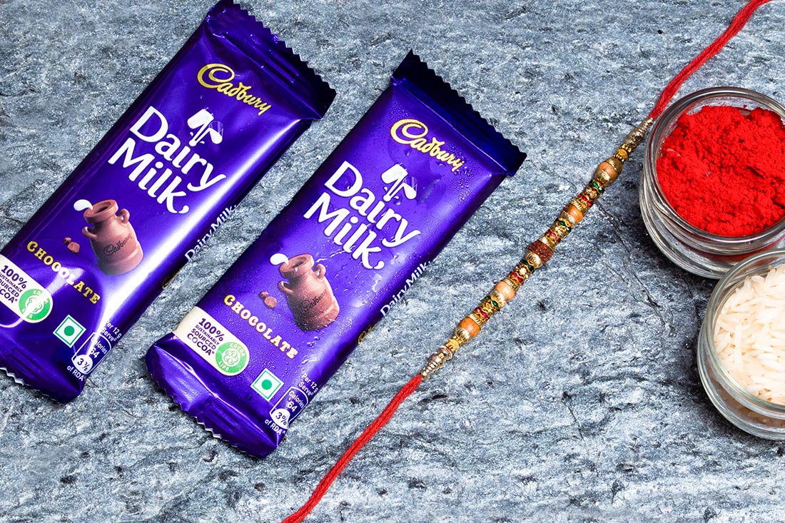 Rudrakash Embedded Rakhi Dairy Milk Combo