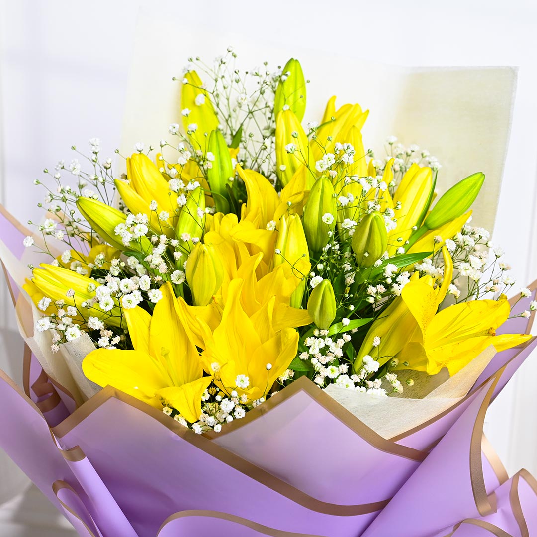 Vibrant Yellow Lily In Purple Paper