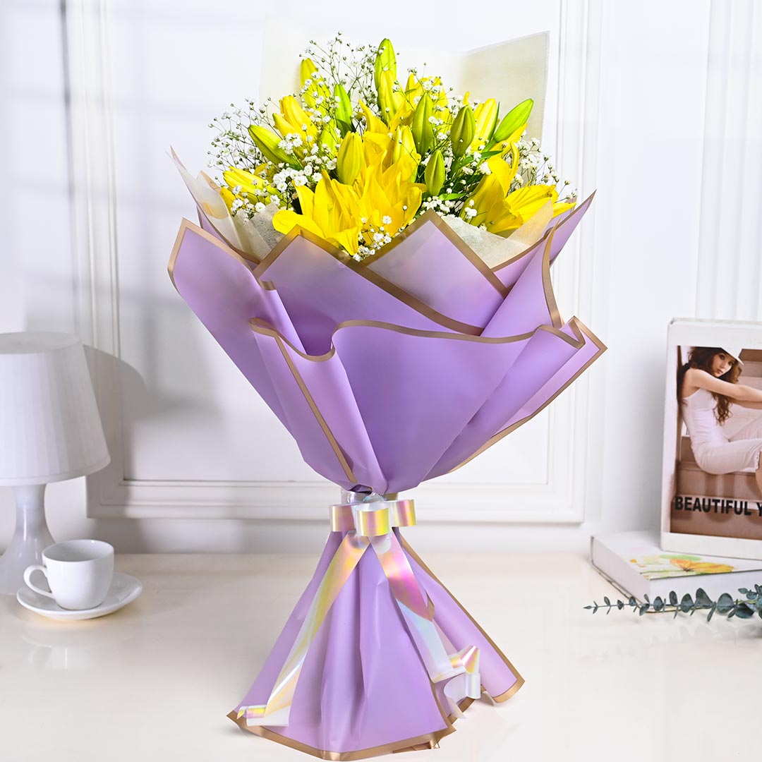 Vibrant Yellow Lily In Purple Paper